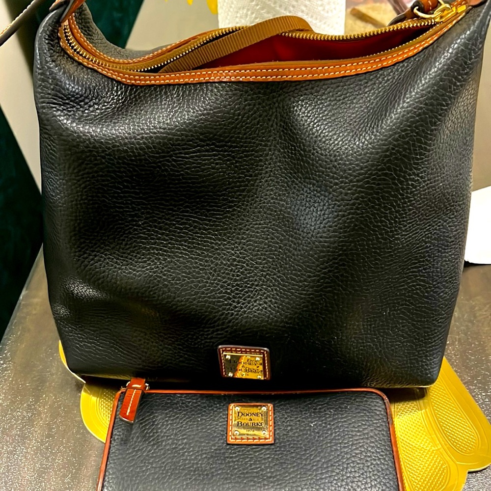 Dooney and burk bag and wallet selling together
